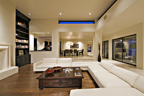 Contemporary living room on hardwood floor in mansion