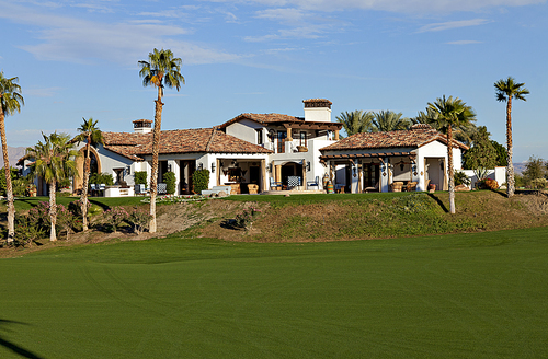 View of mansion with lawn in foreground