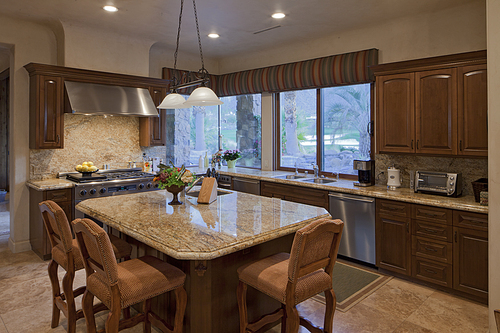 Contemporary kitchen counter with chair in luxury villa