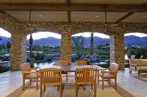 Dining table and chair in patio of luxury villa