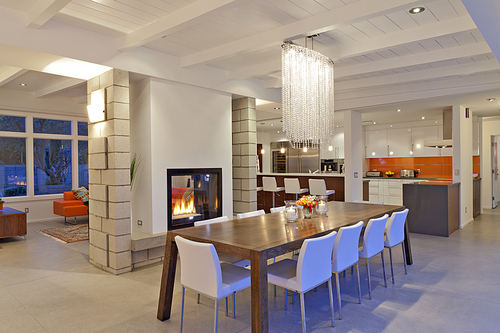 Contemporary chandelier in modern dining room of luxurious villa