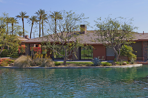 Luxury manor house with swimming pool in foreground