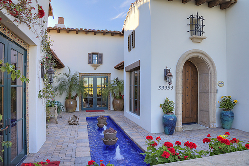 Fountain in front courtyard of luxury manor house