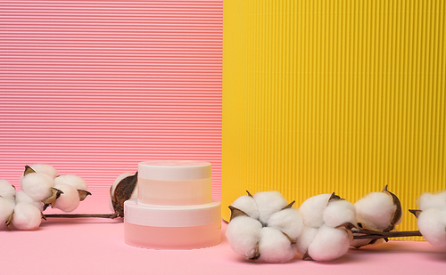 white jar for cosmetics on a pink background. Packaging for cream, gel, serum, advertising and product promotion, mock up