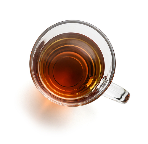 Tea in a glass mug on a white background. The view from the top.