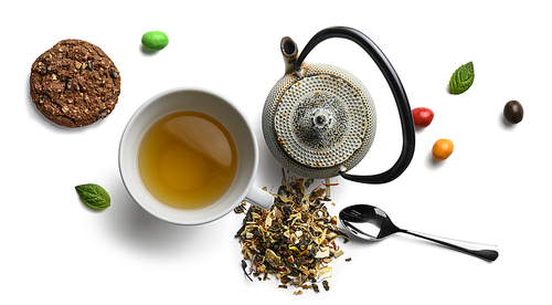 Green tea with natural aromatic additives and accessories. Top view on white background.