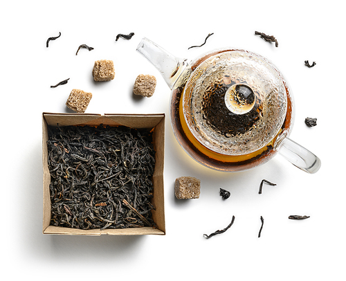 Teapots and tea leaves on a white background. The view from the top.