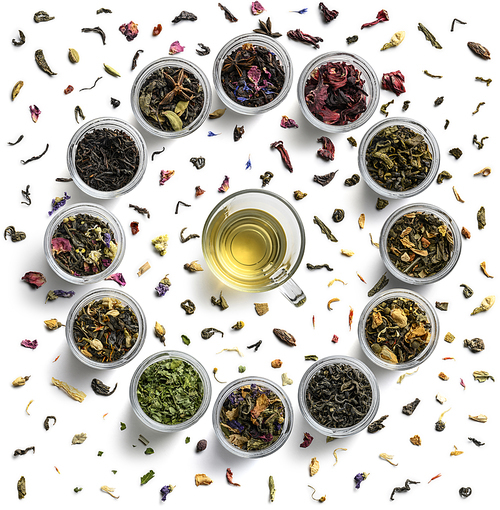 Large tea set in the shape of a clock face. Top view on white background.