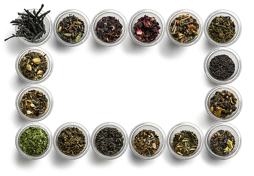 Large assortment of tea on a white background. The view from the top.