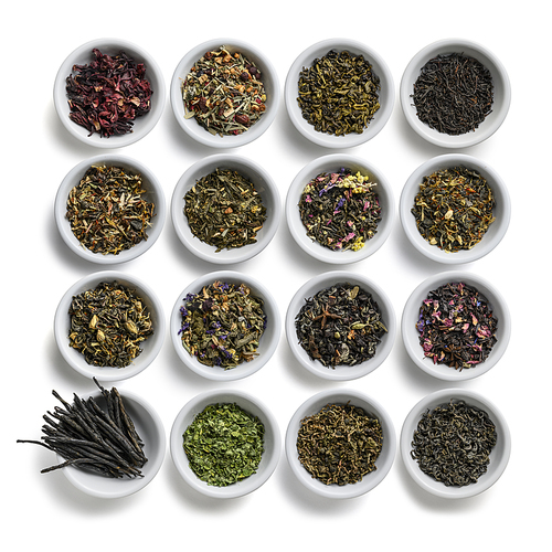 Large assortment of tea on a white background. The view from the top.