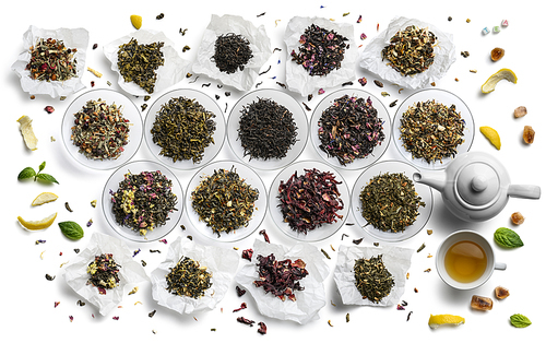 Large assortment of tea on a white background. The view from the top.