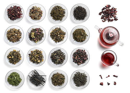 Large assortment of tea on a white background. The view from the top.