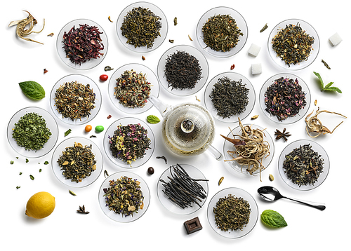 Large assortment of tea on a white background. The view from the top.