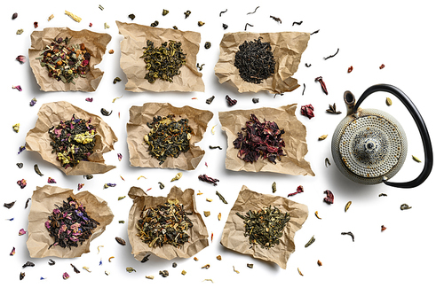 Large assortment of tea on a white background. The view from the top.