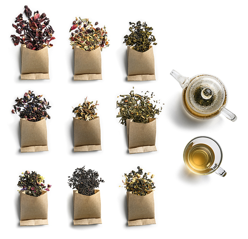 Large assortment of tea on a white background. The view from the top.