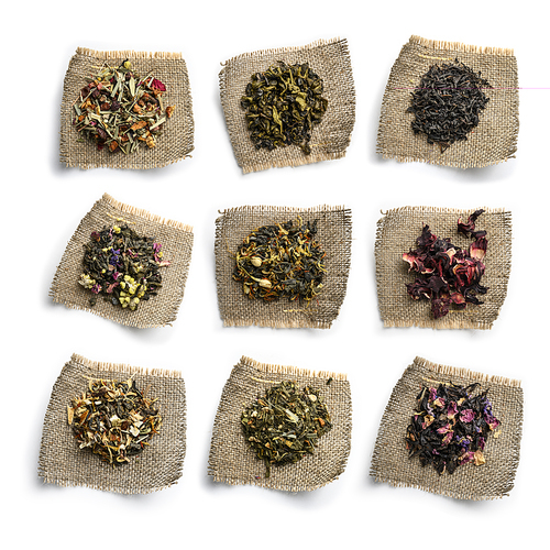 Large assortment of tea on a white background. The view from the top.