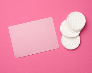 white round blank cotton pads for makeup remover and blank cardboard business card for writing text, advertising and promotion