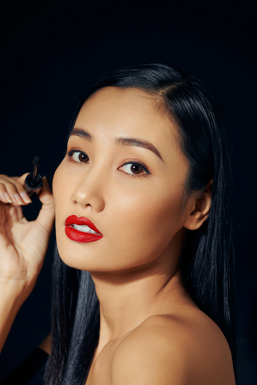 Portrait of Beautiful Young Woman posing in studio