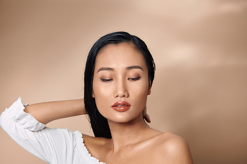 portrait of beautiful young asian woman with flawless skin and perfect make-up