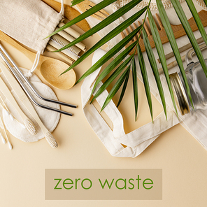 Zero waste concept. Cotton bag, bamboo cultery, glass jar, bamboo toothbrushes, hairbrush and straws on color background, flat lay, copyspace. Plastic free. Sustainable lifestyle concept.