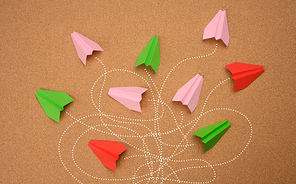 group of paper planes with long tangled paths on a brown background. concept of a strong leader with extraordinary thinking, quick decision-making. Finding the optimal and simple solution in business