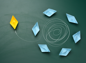 group of boats is floating in a circle, one yellow one has escaped from the trajectory and is sailing in the other direction. Break free from the influence of other people's opinions and bullying of people around