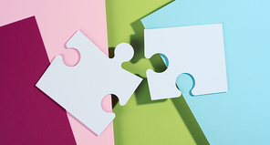 large blank white paper puzzle with shadow, top view. Abstract creative backdrop for designer, top view