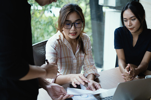Fund managers team discuss, researching and analysis Investment stock market by paperwork