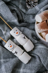 Two happy funny marshmallow snowmen. Marshmallow friends. Diy. Sweet treat for kids funny marshmallow snowman. Christmas winter holiday decoration. New year greeting card. Christmas lights. Cup of cacao