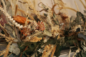 Beautiful and delicate bouquet of dried flowers in interior. Scandinavian style accessories