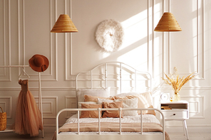 White Scandinavian bedroom in sunshine. Beige accessories. Photo of the interior from the photo studio