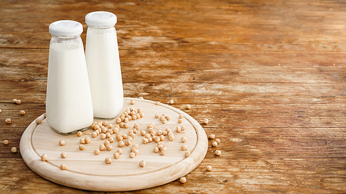 Soy milk and soy bean it on wooden background, healthy concept. Protein of Soy.