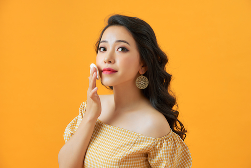 Portrait of beautiful asian woman applying powder puff at cheek makeup of cosmetic, beauty of girl with face smile isolated