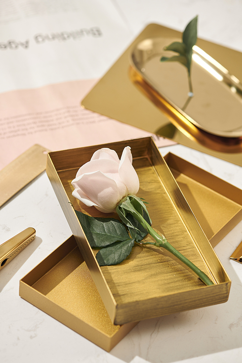 Gold items. Flat lay. Accessories on the table, woman desk top. View top table, background mock up. Envelope top