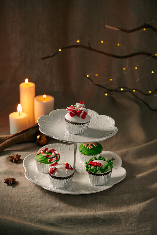 Christmas decoration on cupcakes, beautiful holiday background.