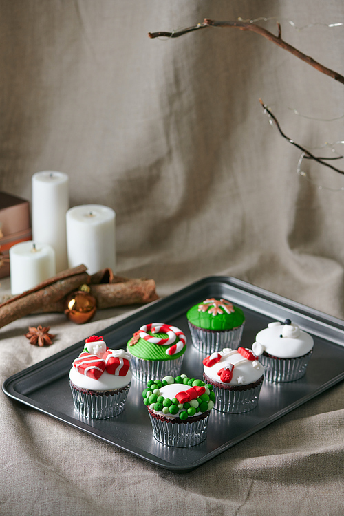 Christmas decoration on cupcakes, beautiful holiday background.