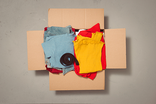 A box full of clothes used in concept donation box