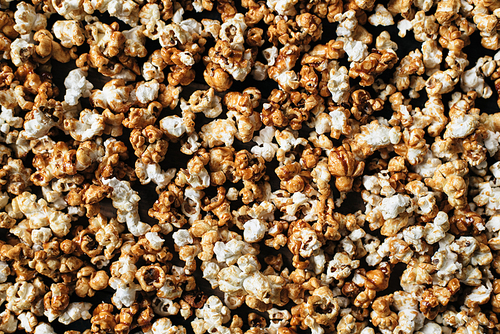 heap of fresh popcorn as a background, wallpaper and backdrop