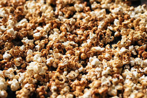 heap of fresh popcorn as a background, wallpaper and backdrop