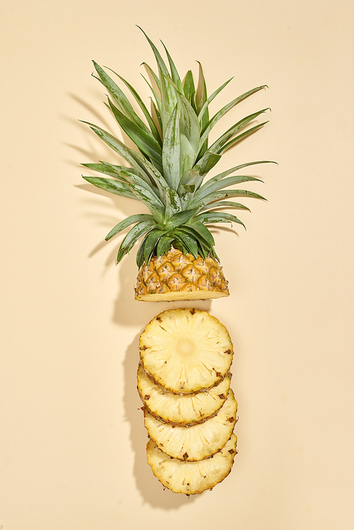 Sliced pineapple isolated on white. Top view.