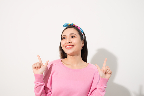 young attractive asian woman who points to the finger