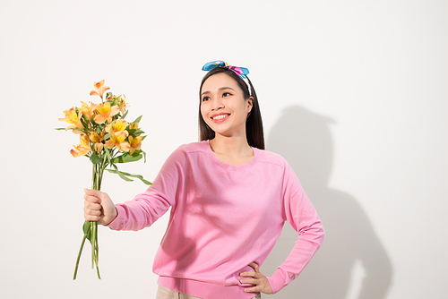 Lifestyle leisure international women's day concept. Close up portrait of lovely cute adorable excited delightful attractive woman holding flowers isolated on white