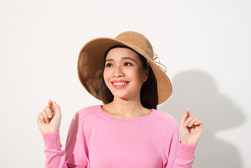 Portrait of a beautiful woman in a straw hat. Laughing girl. Summer time