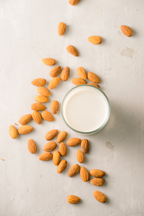 Almond milk in glass. Organic healthy snack vegan vegetarian