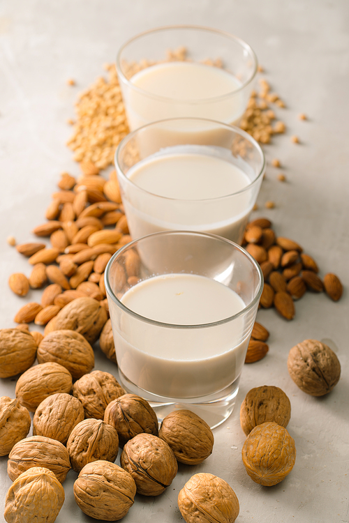 Glasses of milk: Macadamia, almond, soy. Top view.