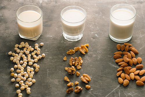 Glasses of milk: Almond, soy, walnut. Top view.