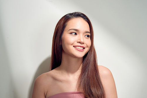 Portrait of positive girl with beaming white smile enjoying sun light looking away having isolated on white