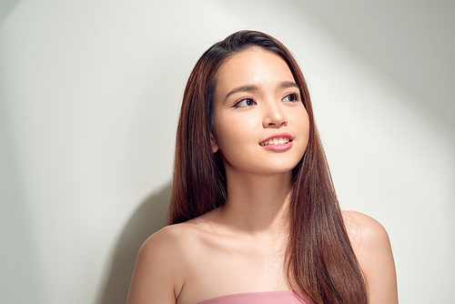 Portrait of positive girl with beaming white smile enjoying sun light looking away having isolated on white