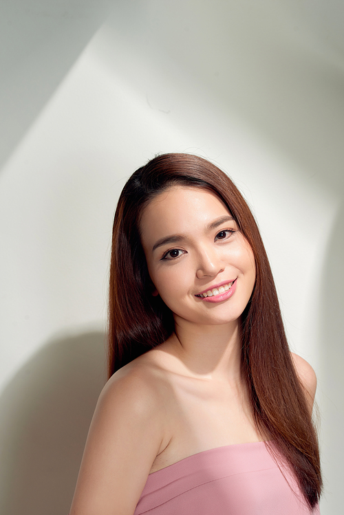 Portrait of nice good girl with modern hairdo, white smile  looking at camera isolated on white having fun