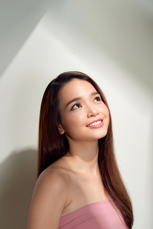 Portrait of nice good girl with modern hairdo, white smile  looking at camera isolated on white having fun